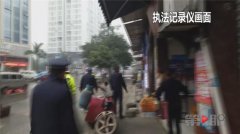 摩托违停被查 车主竟欲点燃煤气罐